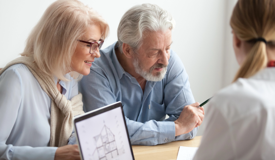Senior couple looking at their credit score to buy a home image